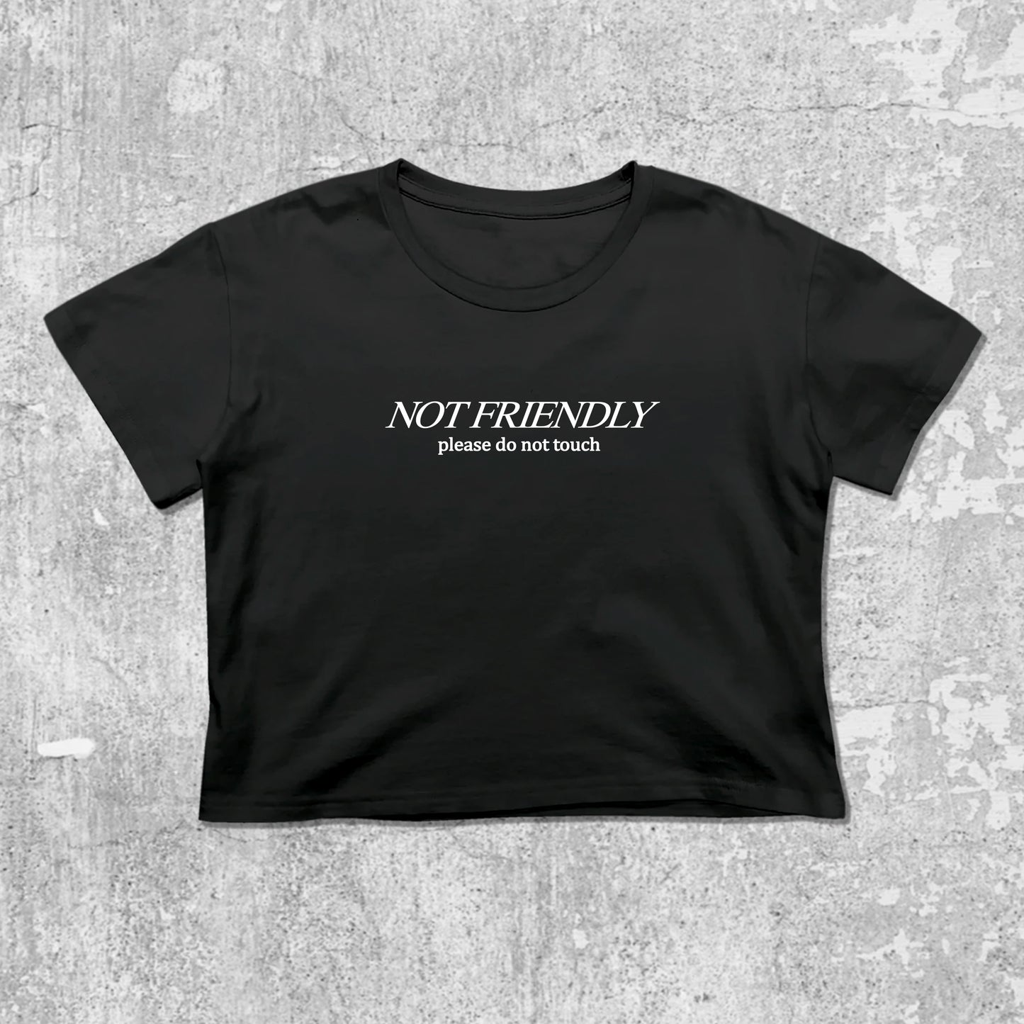 Not Friendly Please Do Not Touch graphic crop tee with cute and trendy fit, featuring playful vintage graphic, stylish cut. Black crop t-shirt