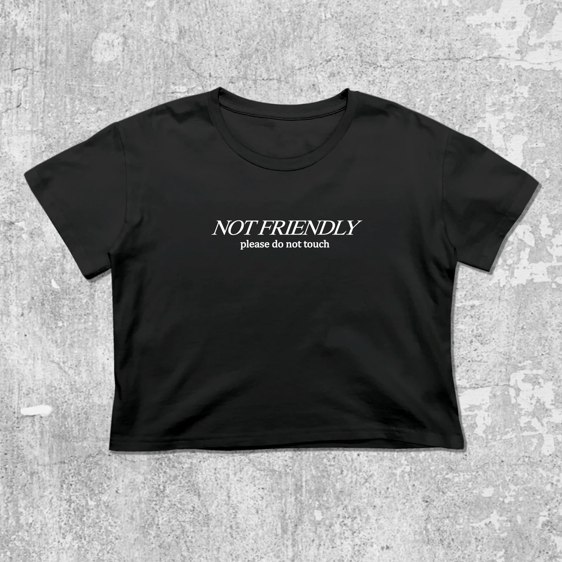 Not Friendly Please Do Not Touch graphic crop tee with cute and trendy fit, featuring playful vintage graphic, stylish cut. Black crop t-shirt