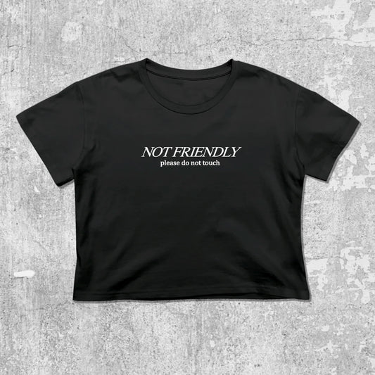 Not Friendly Please Do Not Touch graphic crop tee with cute and trendy fit, featuring playful vintage graphic, stylish cut. Black crop t-shirt