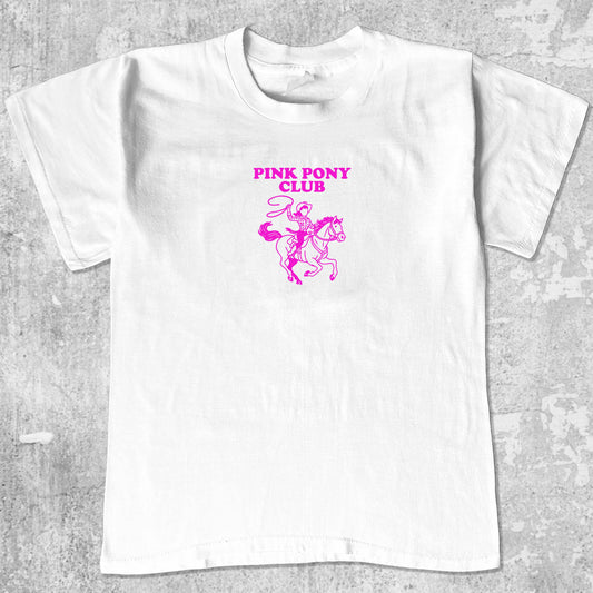 Pink Pony Club graphic tee with bold and humorous print, funny and trendy graphic. Perfect for adults and gift-giving. White shirt.
