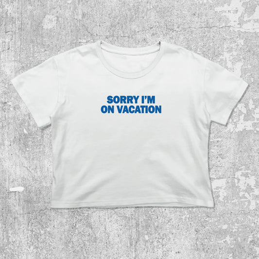 Sorry i'm on vacation graphic crop tee with cute and trendy fit, featuring playful vintage graphic, stylish cut. White crop t-shirt