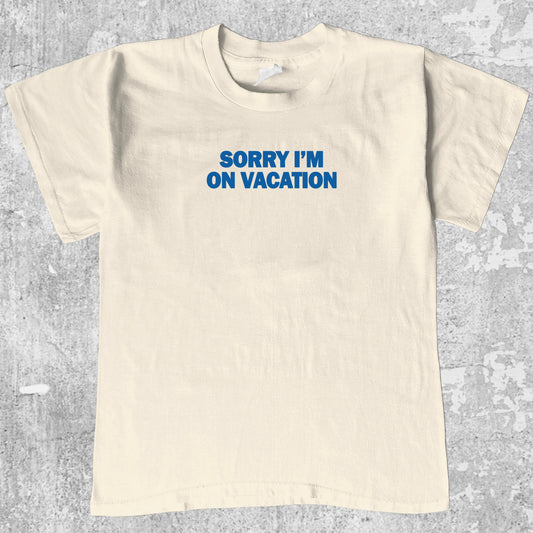 Sorry i'm on vacation graphic tee with bold and humorous print, funny and trendy graphic. Perfect gifts for friends and family. Cream shirt.